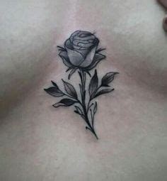 Rose tattoo between breast